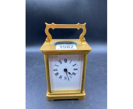 A French brass case travelling clock 