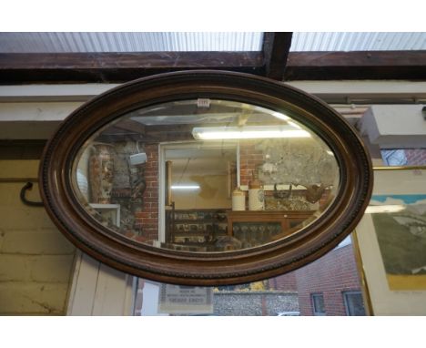 Two Pears prints, largest 68 x 45cm, smallest unframed; together with an oval wall mirror, 54 x 81cm. (3) 