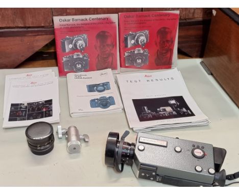 Cameras: a Leicina Super RT1 8mm film camera, with instructions and original case; together with a further Leitz Summicron le