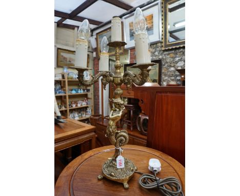 A brass figural five branch table light, 58.5cm high. 