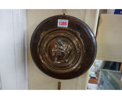 A pair of French brass portrait profile plaques,&nbsp;each in oak frame, 24cm diameter. 