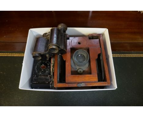 An antique mahogany plate camera, bearing ivorine label inscribed 'J Lancaster &amp; Son', (incomplete); a pair of early 20th