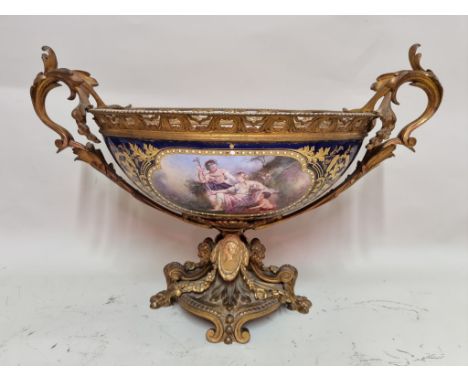 A large and impressive 19th century Sevres style and gilt bronze mounted twin handled centrepiece,&nbsp;painted to both sides