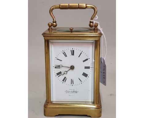 An antique brass carriage clock,&nbsp;striking on a gong, with push button repeat, height including handle 16cm. 