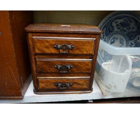 A small old mahogany chest, 27cm wide, (formerly part of a larger item). 