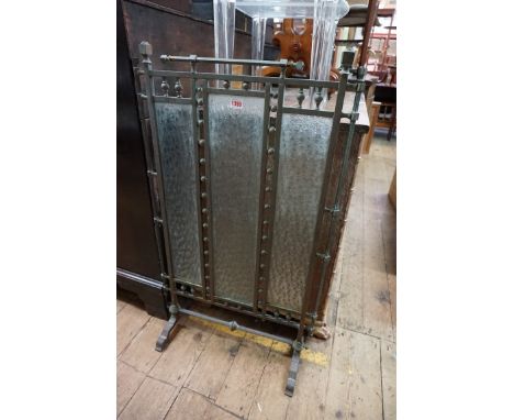 An Arts and Crafts brass and glass firescreen, 96.5cm high by 55.5cm wide.&nbsp; 