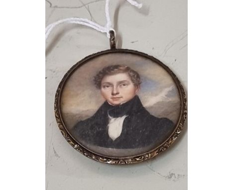 English School, early 19th century, portrait miniature of a young gentleman, on ivory, 6.3 x 5.3cm oval, in a gilt metal fram