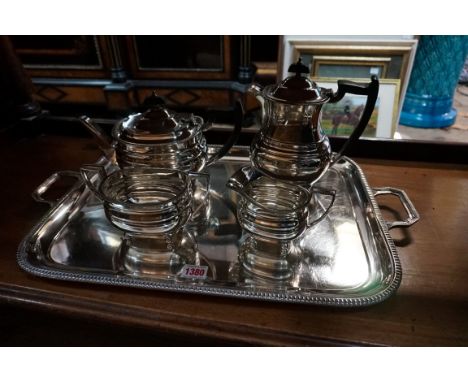 A silver plated four piece tea set and similar tray, by Mappin &amp; Webb, the tray 59.5cm wide.&nbsp; 