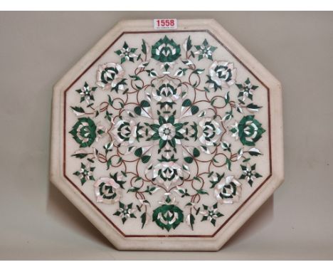 A marble and pietra dura octagonal panel, decorated with malachite and mother-of-pearl, 31cm diameter.&nbsp;&nbsp; 