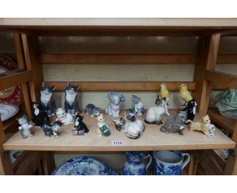 A collection of pottery and porcelain cats, to include examples by: Royal Copenhagen; Goebel; Royal Doulton; and Lladro; toge