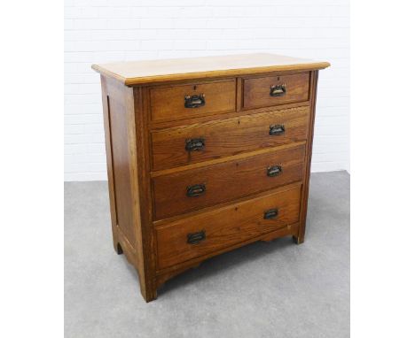 Early 20th century oak chest, the rectangular top above two short and three graduating long drawers with Art Nouveau copper p