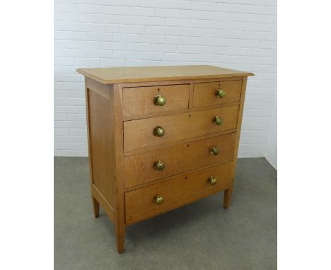 Early 20th century light oak chest, the moulded rectangular top above two short and three graduating long drawers on short ta