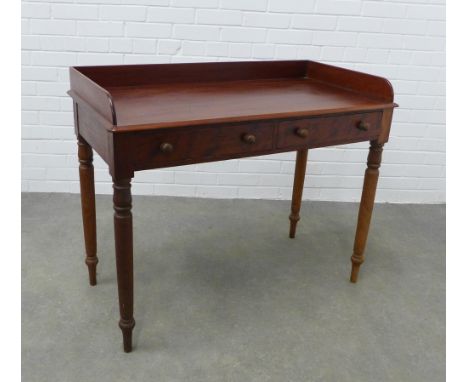 Victorian mahogany writing table with a three quarter gallery and two frieze drawers, ring turned legs, 82 x 103 x 52cm. 