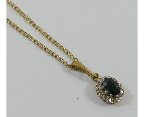 A 9 carat gold sapphire and diamond oval cluster pendant, the dark oval mixed cut sapphire claw set within small diamond surr