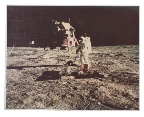 
	
		Neil Armstrong
		Buzz Aldrin deploys the Early Apollo Scientific Experiments Package on the surface of the Moon (EASEP).