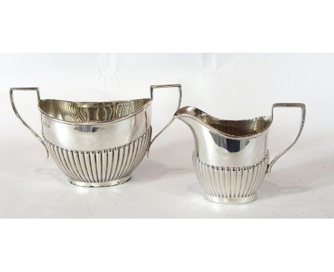 George V silver two-handled oval sugar basin with half fluted body, together with a matching cream jug, Birmingham 1913/14, 8