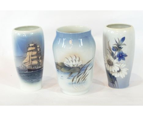 A Royal Copenhagen porcelain vase with lily leaf and reed decoration with a sky blue rim, a Royal Copenhagen porcelain taperi