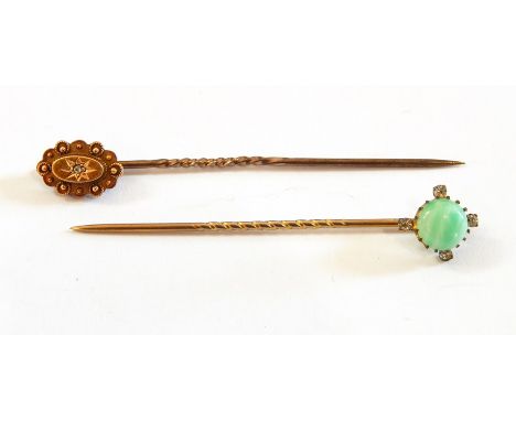 A jade and diamond stickpin set centre polished cabochon jade and having surround of four tiny diamonds and a 15ct gold and d