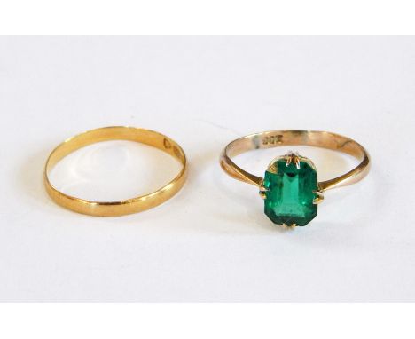 22ct gold fine wedding ring and a 9ct dress ring set with green stone 