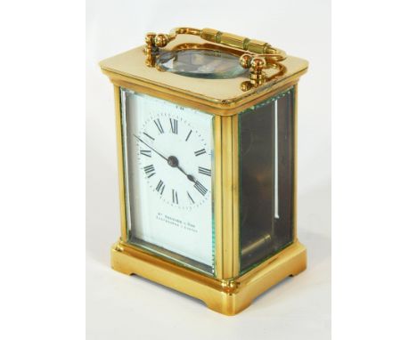 A French carriage clock timepiece, the brass case with glazed panels, the enamel dial with Roman numerals, retailed by Willia