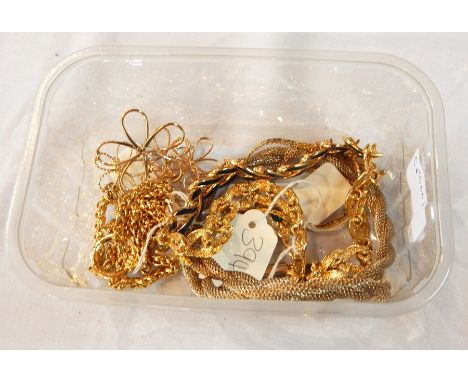 A gold colour necklace with dark blue enamel leaf style links, a gold colour necklace set with jade coloured stones and three