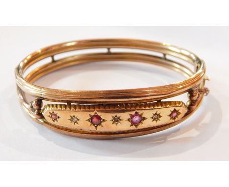 Edwardian 9ct gold and ruby/garnet bangle, twin reeded bands set four pink stones, Chester 1908, approx. 10g 