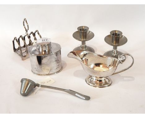 A silver plated sugar bowl and matching cream jug by Hardy Brothers, Sidney and Brisbane, a silver plated sauce boat, toast r