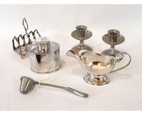 A silver plated sugar bowl and matching cream jug by Hardy Brothers, Sidney and Brisbane, a silver plated sauce boat, toast r