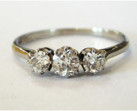 Platinum and 18ct gold three-stone diamond ring, the three stones approx. total 0.5ct 