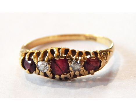 18ct gold, ruby and diamond five-stone ring with central oval cut ruby flanked by pair brilliant cut diamonds, with two furth