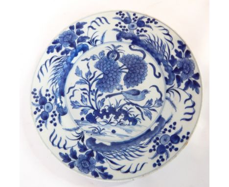 Pair of 18th century Chinese blue and white plates, the outer rim with wedge-shaped trophies and motifs, fern-type detailing 