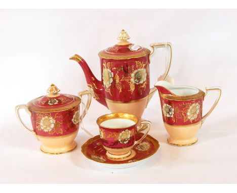 A Noritake porcelain coffee service for six persons decorated with peonies in gilt, on a puce ground and having tooled gold b