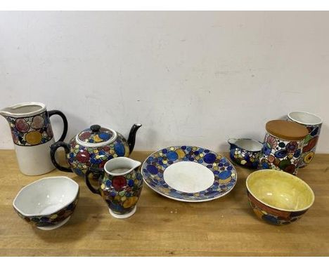 A collection of studio pottery in polychrome abstract design including teapot which measures 13cm x 17cm, water jug, jar, mil