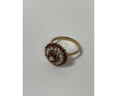A pearl and ruby cluster ring with 9ct gold mount and shank size R/S