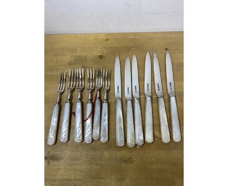 A set of six 1928 fruit knives and forks with mother of pearl handles and Mappin and Webb Sheffield silver blades and tines, 