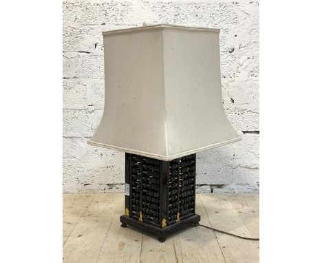 A modern Chinese table lamp, the base formed of four abacus, on ogee bracket supports, H54cm to top of shade