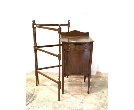 An Edwardian mahogany bow front bedside table, with raised back over drawer and cupboard, raised on square tapered supports, 