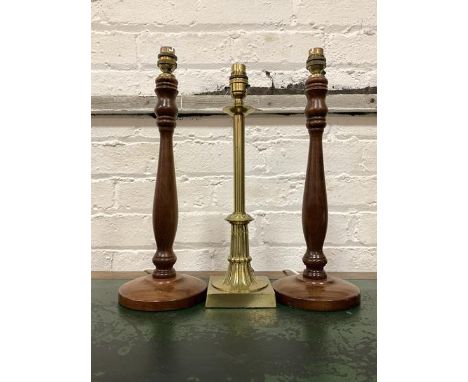 A Pair of 20th century turned ash table lights (H41cm) together with a cast brass table light (H38cm)