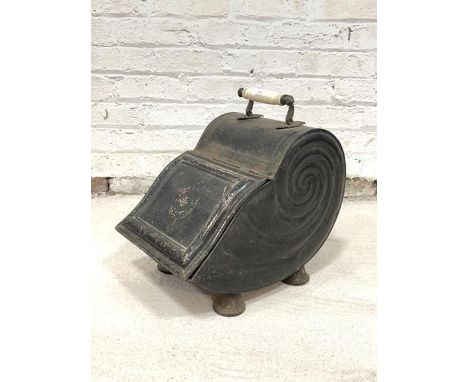 A Victorian Japanned toleware coal scuttle of shell form, with ceramic handle, gilt stencilled detail, original shaped liner,