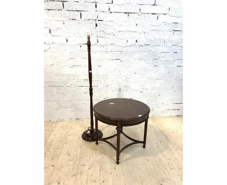 A Regency style mahogany lamp table, the circular top on reeded supports with bowed stretchers (H52cm, D65cm) together with a