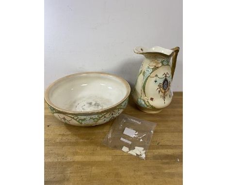 A late 19th early 20thc Crown Devon wash basin and ewer, basin a/f, ewer measures 32cm high (2)