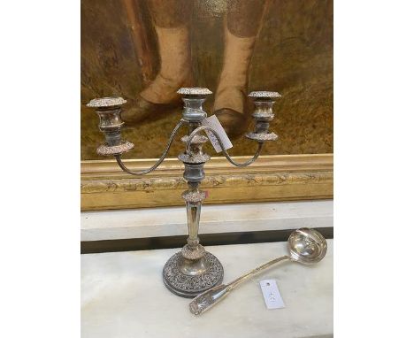 A silver plated two armed candelabra measures 41cm high along with an Epns ladle