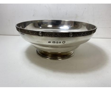 A 1935 London silver footed bowl, makers mark AS, celtic knot decoration to rim, measures 8cm x 19cm and weighs 413 grammes