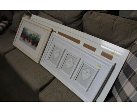 A framed print ; and three photo frames