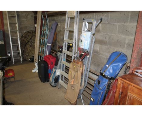 A vintage golf bag and contents together with an ironing board