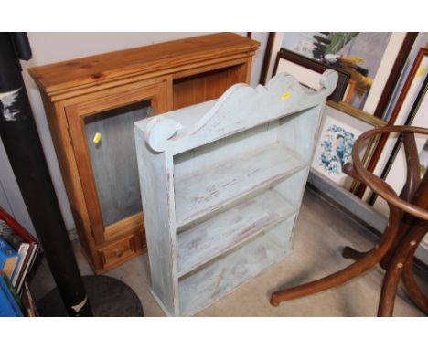 A painted wall shelf and a pine wall cupboard with mirror