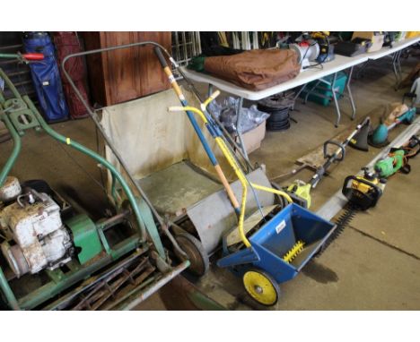 A lawn sweep; scarifier and seed spreader
