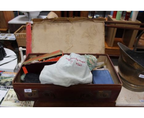 A vintage case and contents including gloves, lace etc.