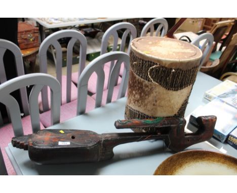 A wooden musical instrument and an African drum