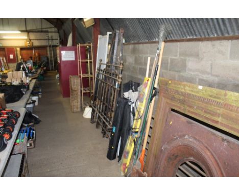 A trailer light board together with a quantity of long handled gardening tools 